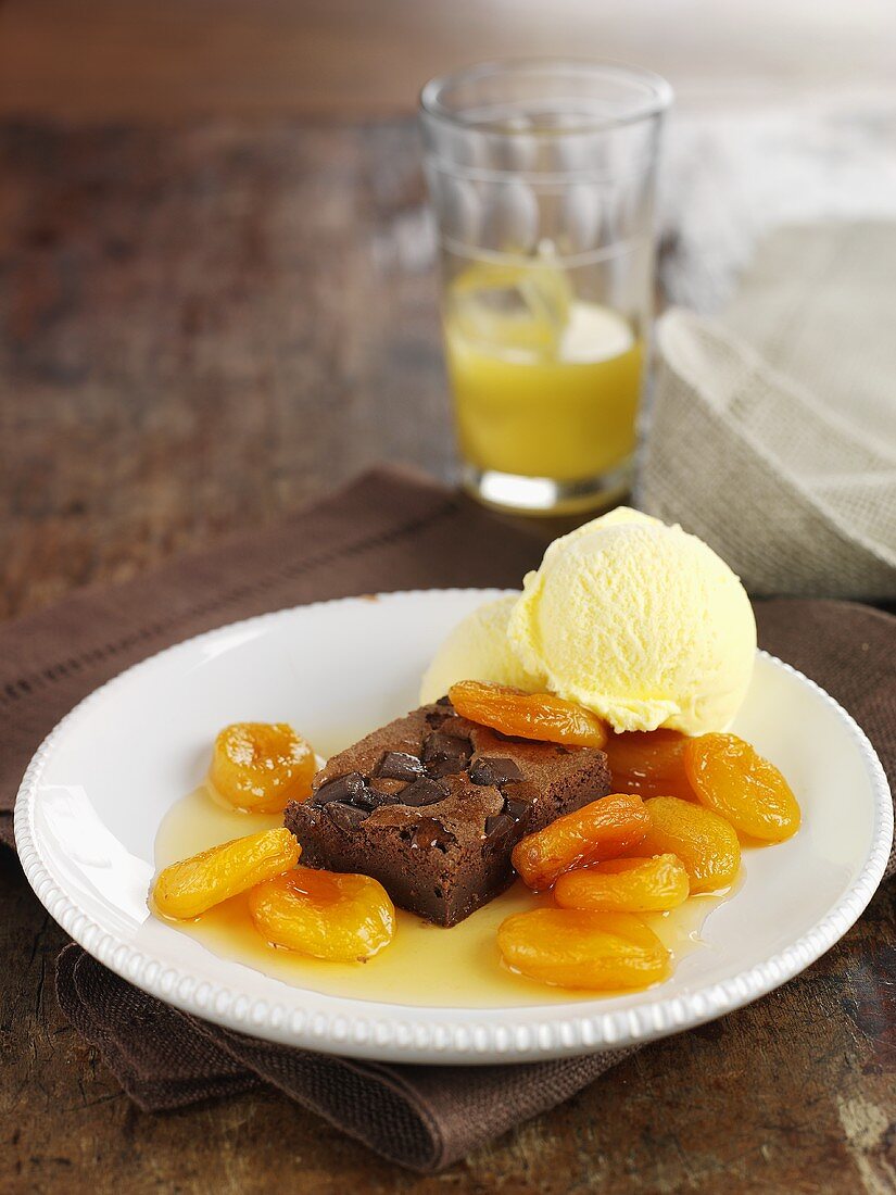 Brownie with apricot compote and vanilla ice cream