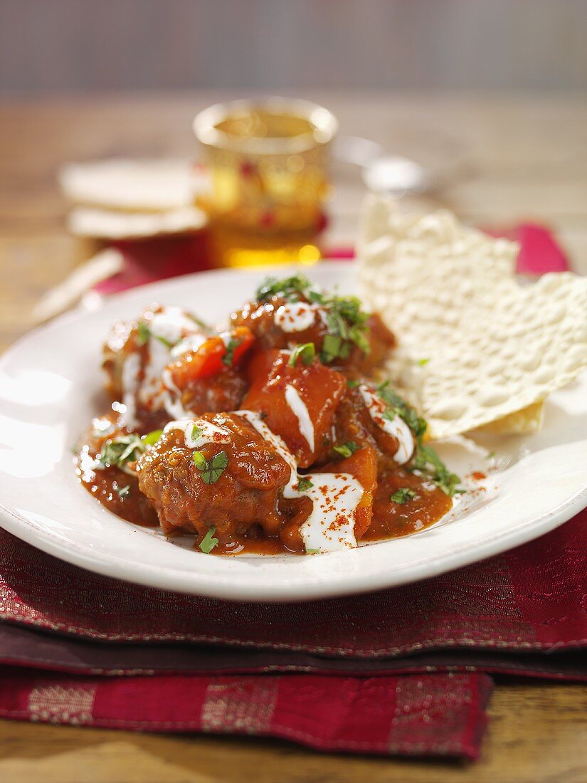 Meatballs in curry sauce with flatbread