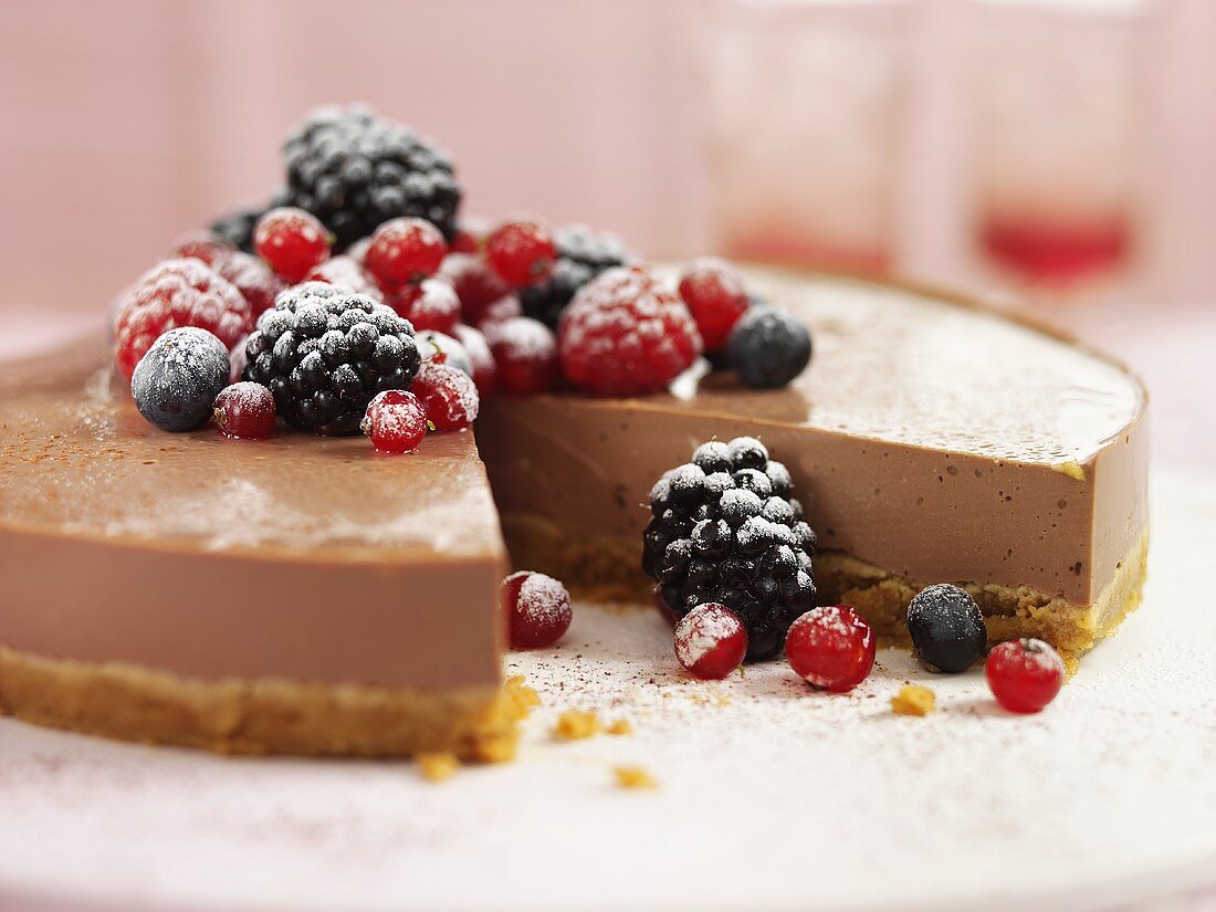 Cheesecake with berries, a piece removed