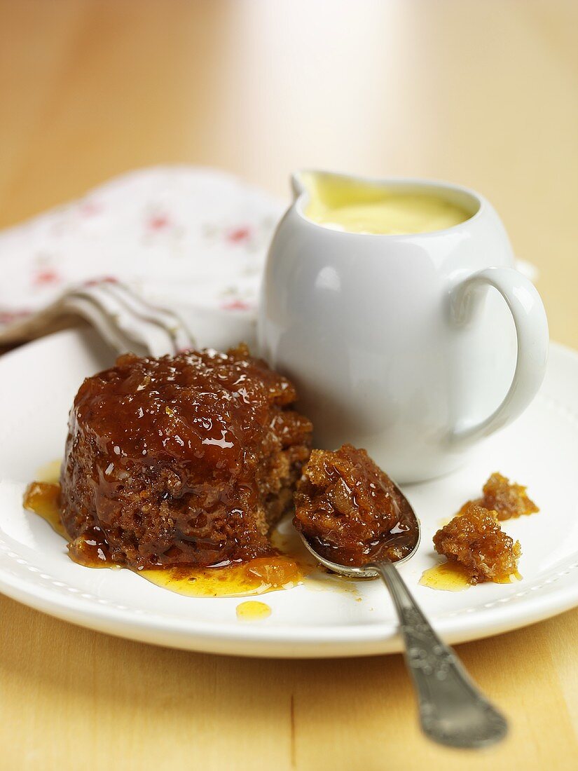 Ginger pudding and small jug of custard