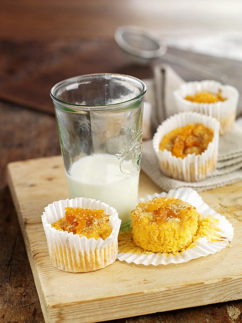 Muffins in paper cases and glass of milk