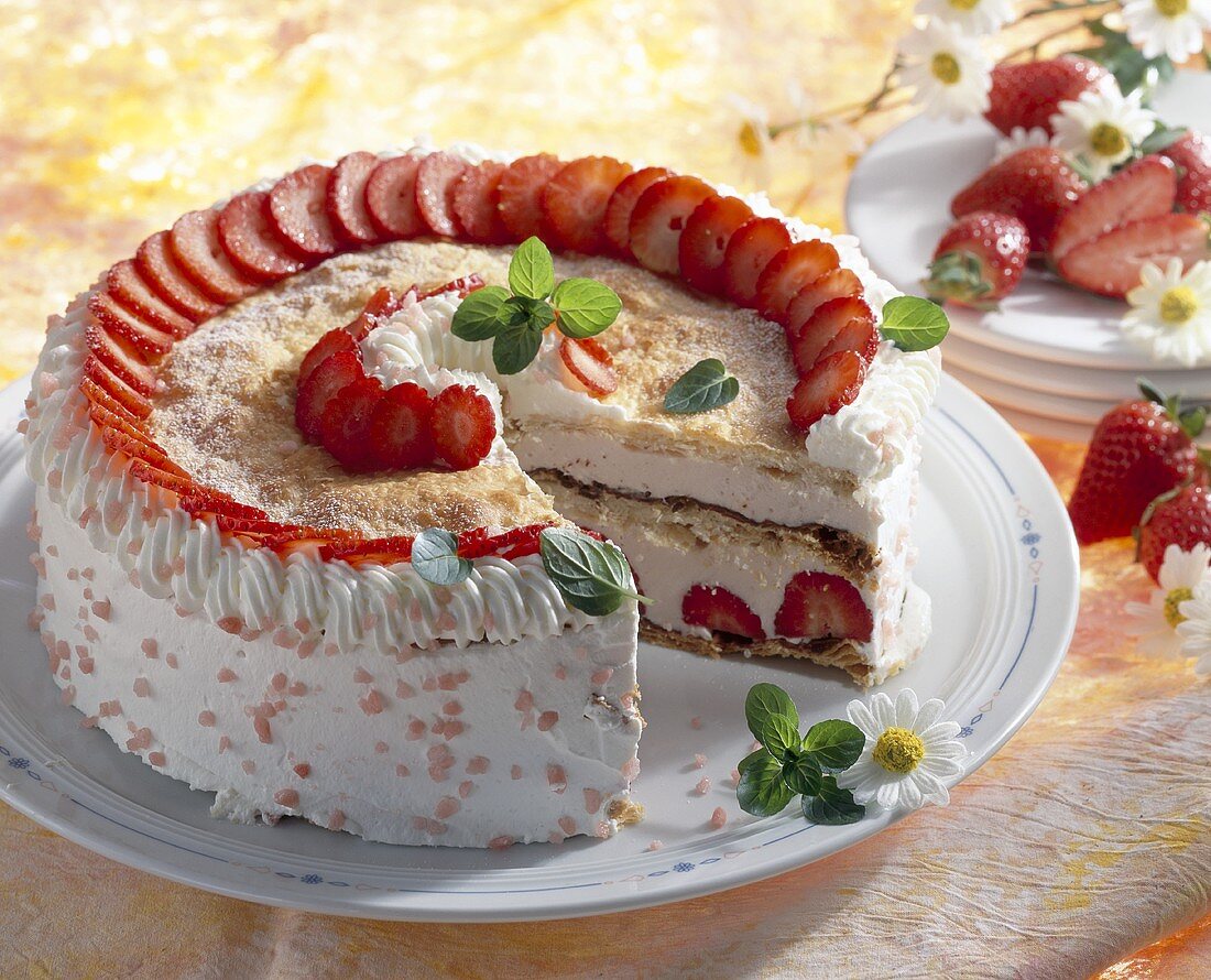 Strawberry gateau with cream & puff pastry, a piece taken