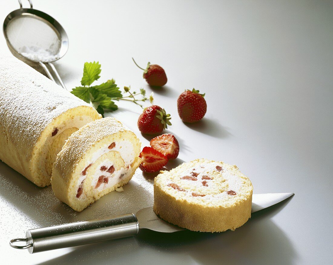 Strawberry and cream roulade, partly sliced