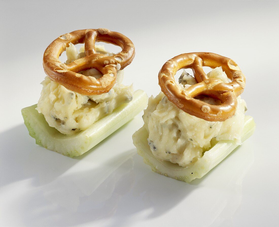 Celery boats with cheese and salted pretzels