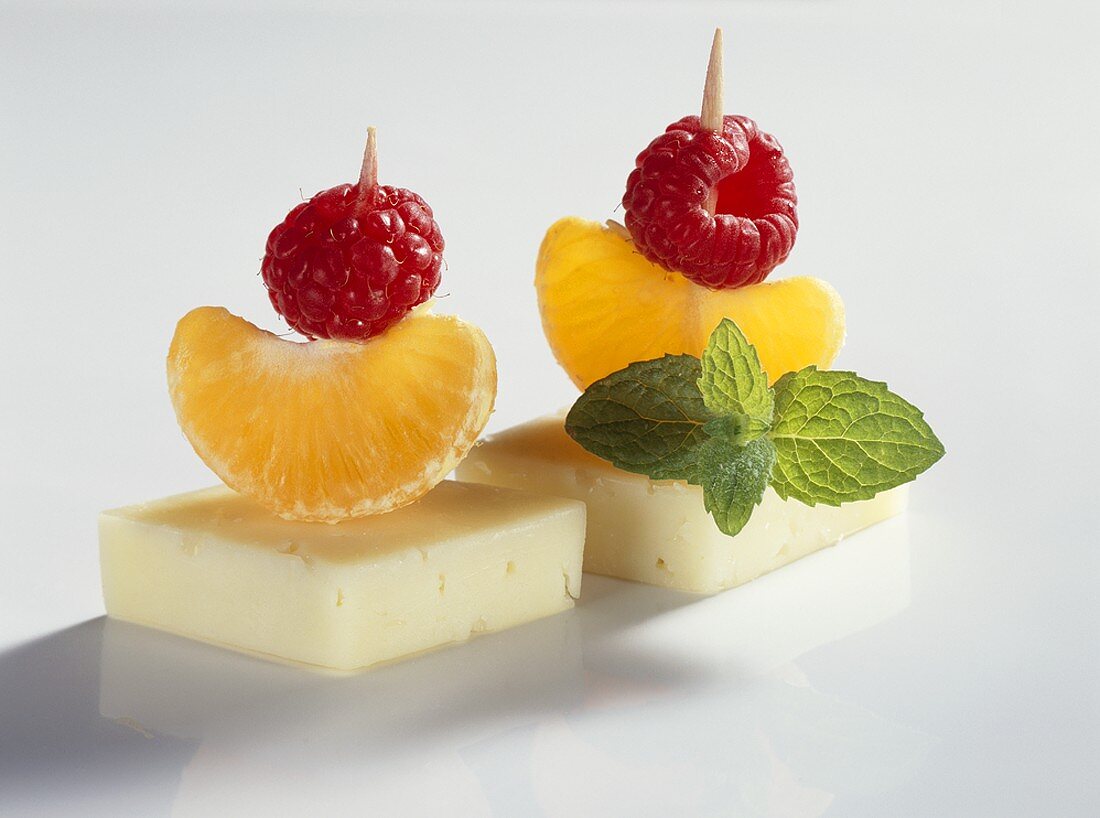 Cheese and fruit on two cocktail sticks