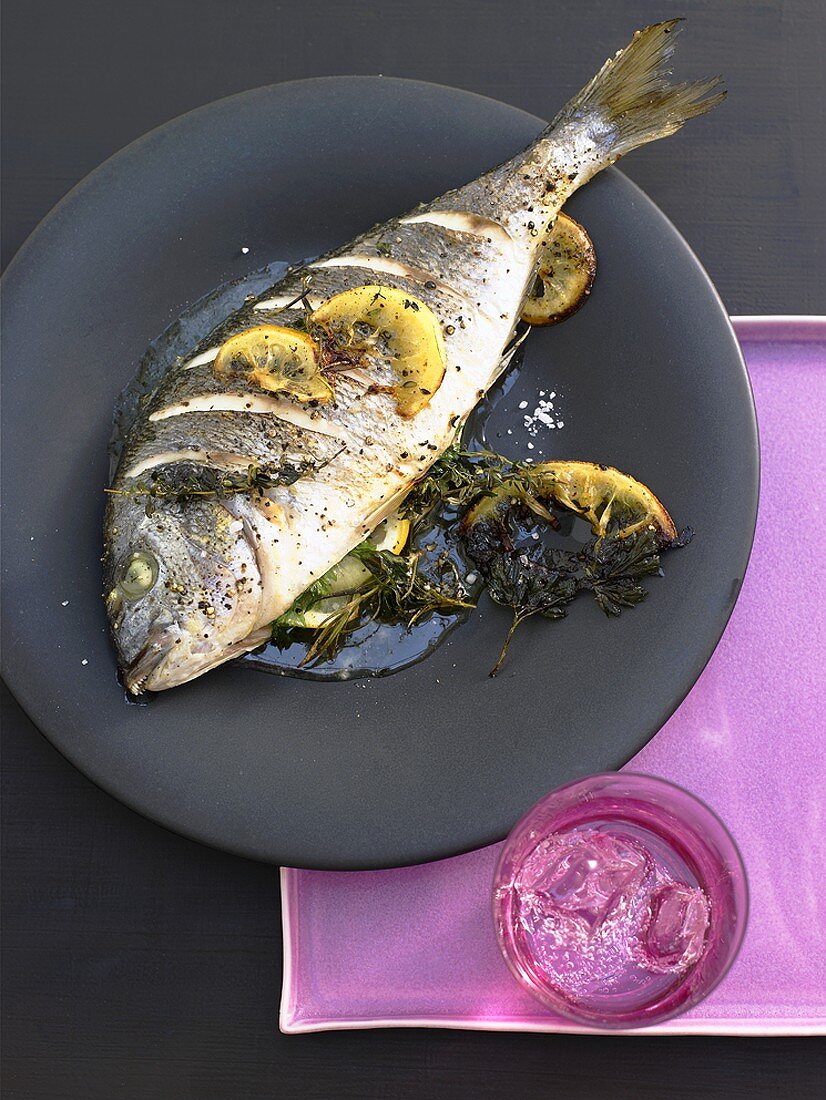 Roast sea bream with lemon and herbs