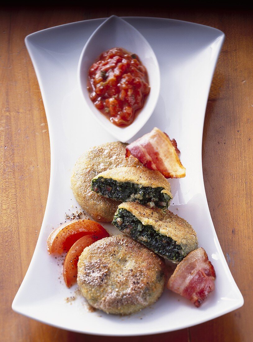 Kale cakes with bacon and spicy tomato sauce