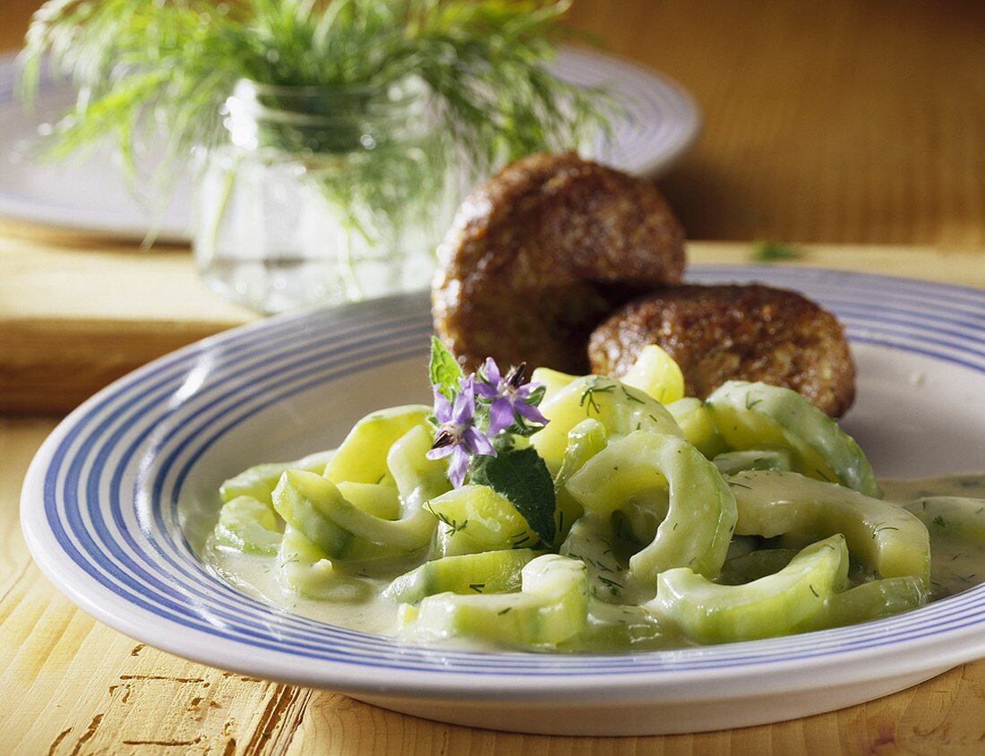 Creamed cucumber with meat patties