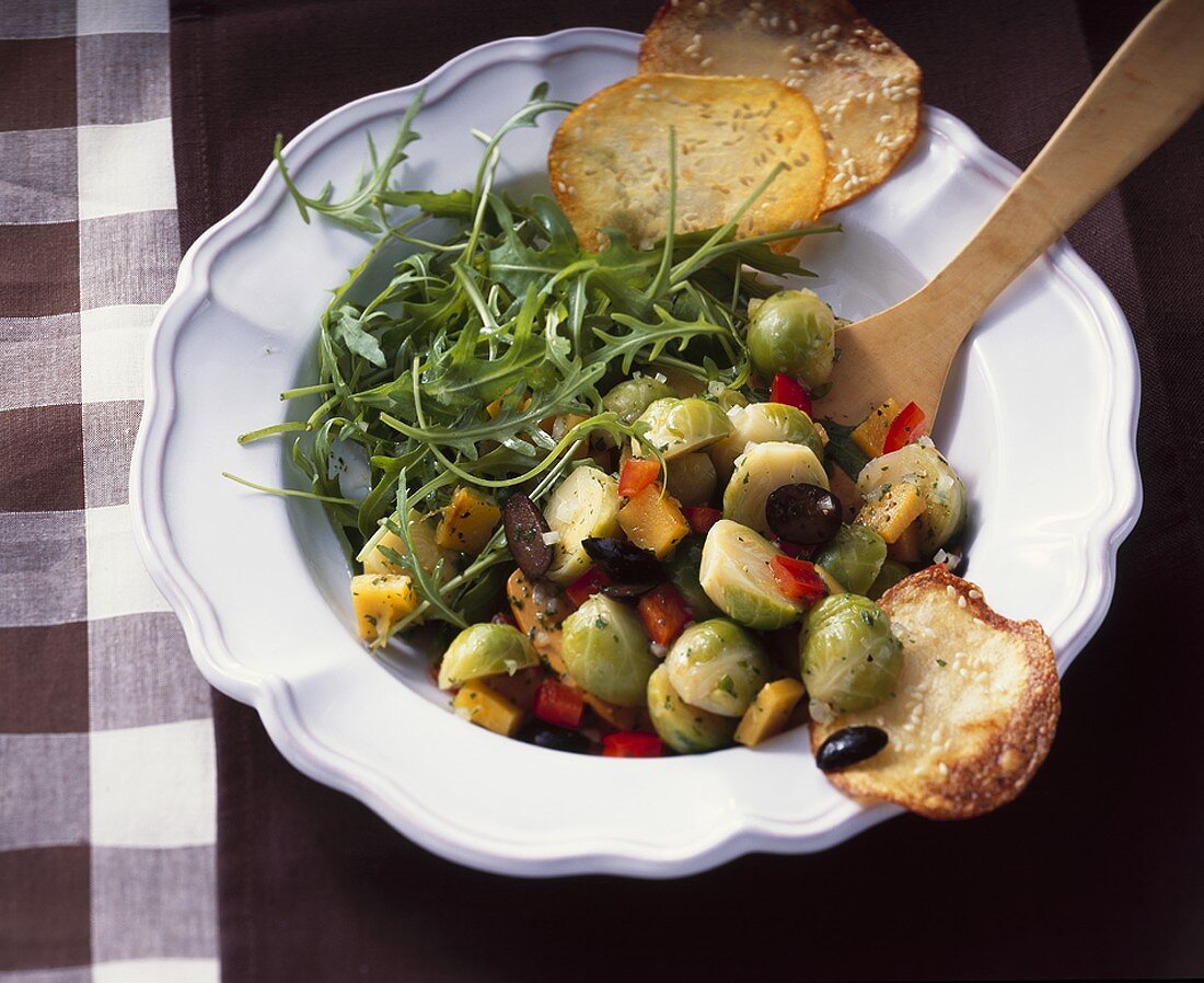 Brussels sprout & pumpkin salad with rocket & potato crisps