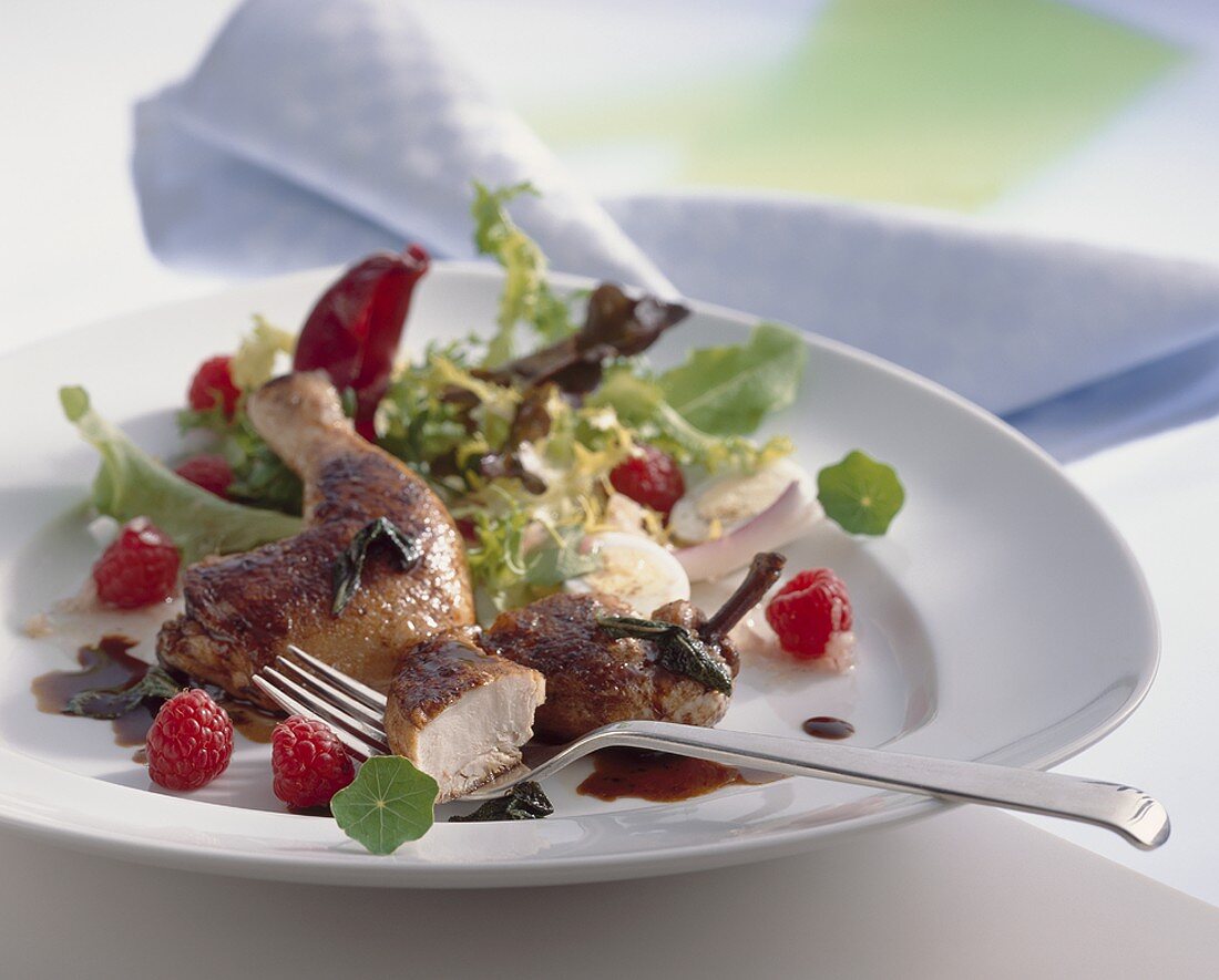 Salad with lukewarm poussin and raspberries