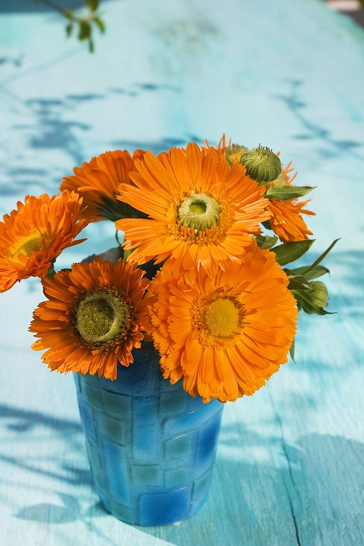 Marigolds in mother-of-pearl beaker