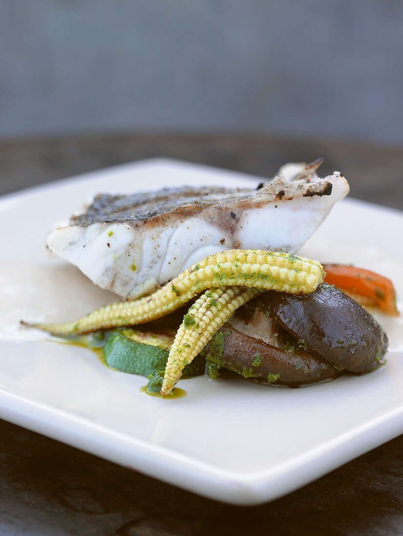 Grilled sea bass with pesto vegetables