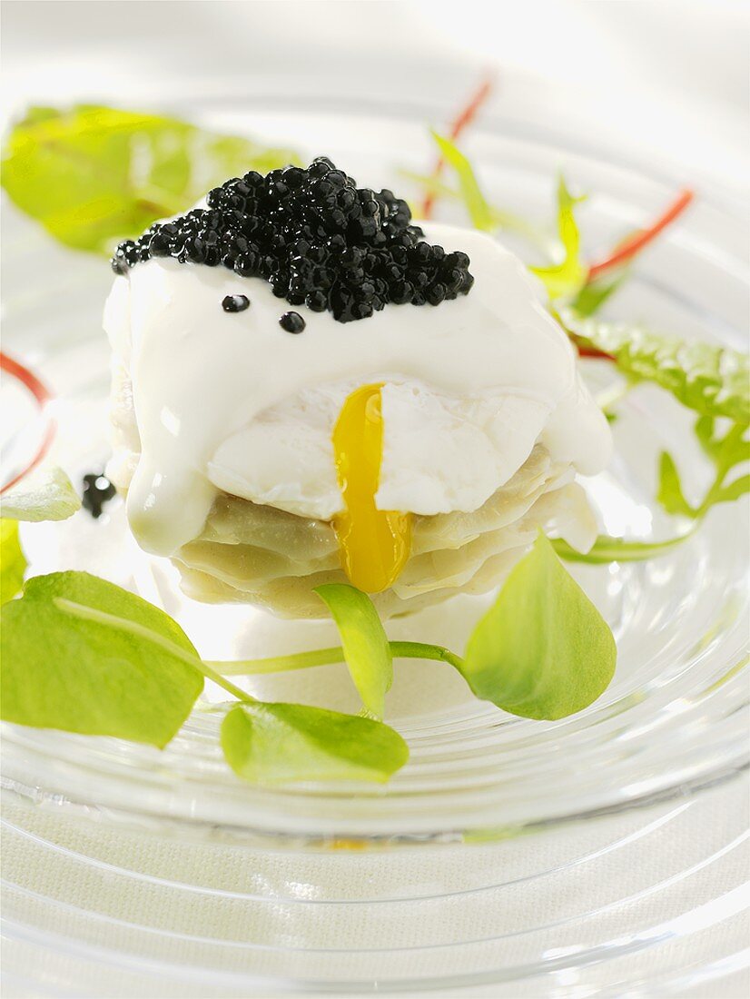 Poached egg with caviar on artichoke