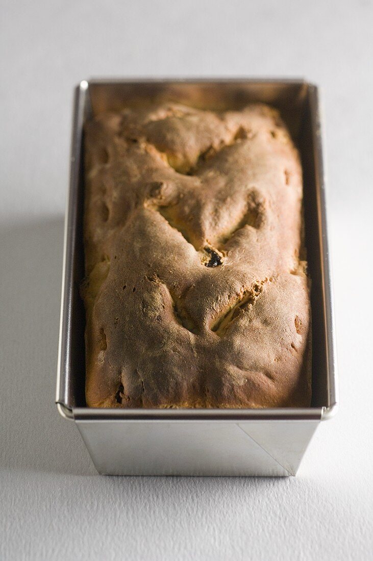 Chestnut and apricot bread in baking tin