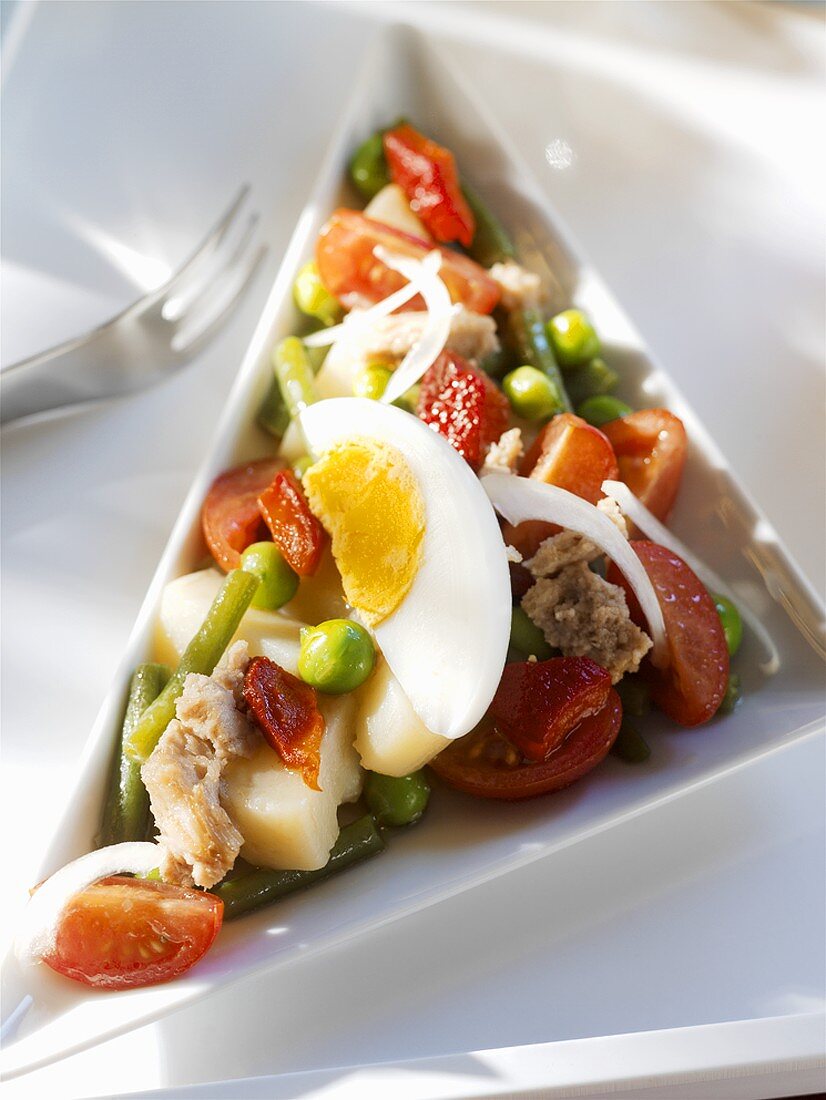 Egg, tuna, cheese and vegetable salad