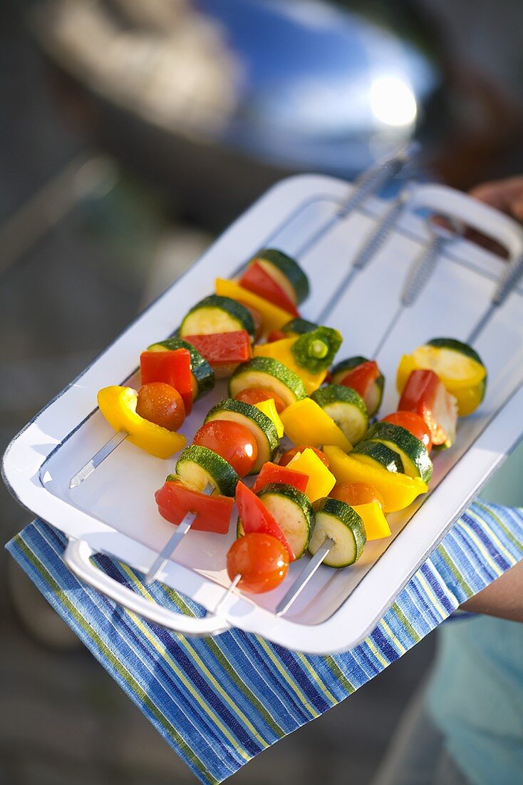 Raw vegetable kebabs ready for grilling
