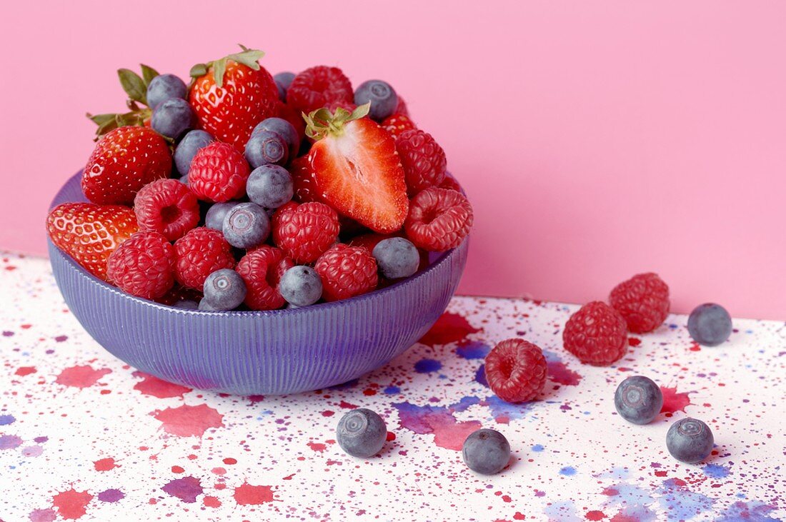 Mixed berries in blue bowl