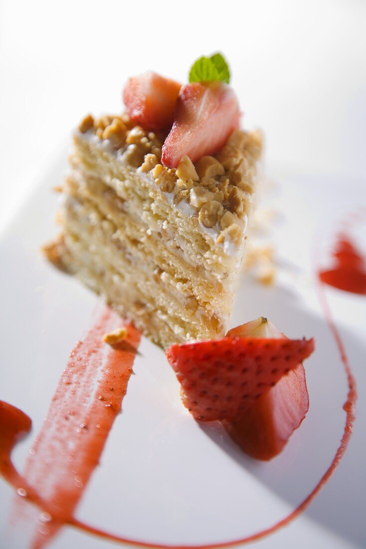 Piece of peanut cake with strawberries