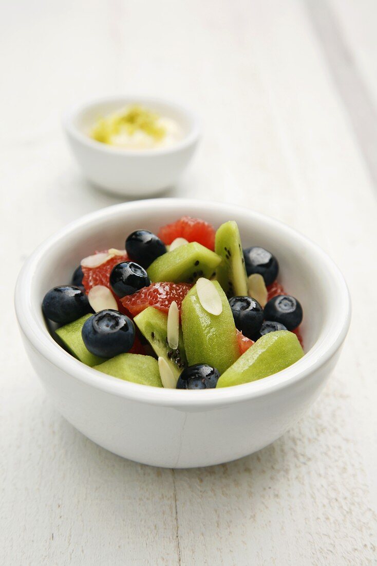 Fruit salad with flaked almonds