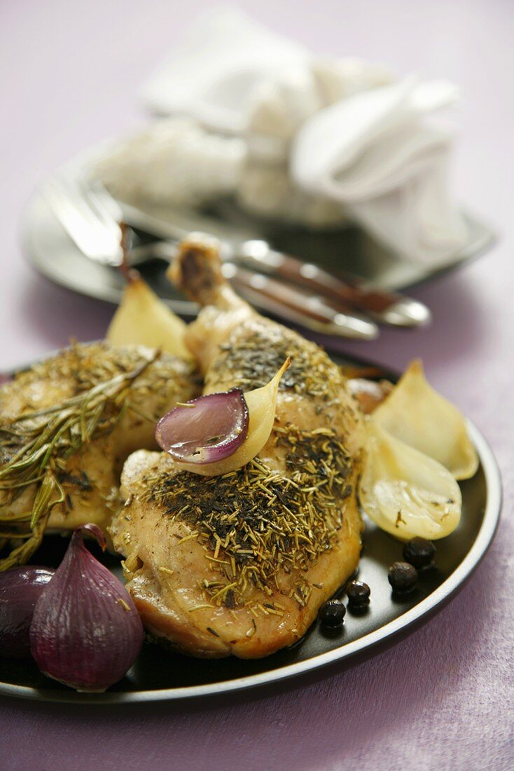 Chicken legs with thyme, rosemary and onions