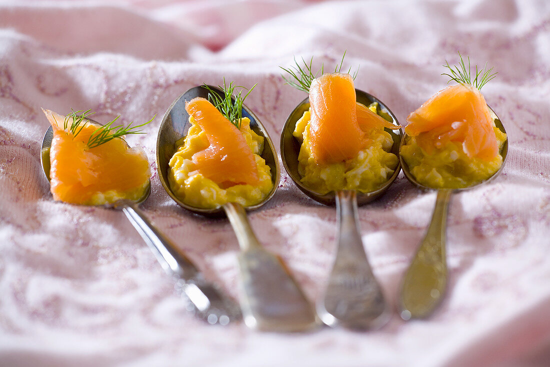 Egg paste with smoked salmon on four spoons