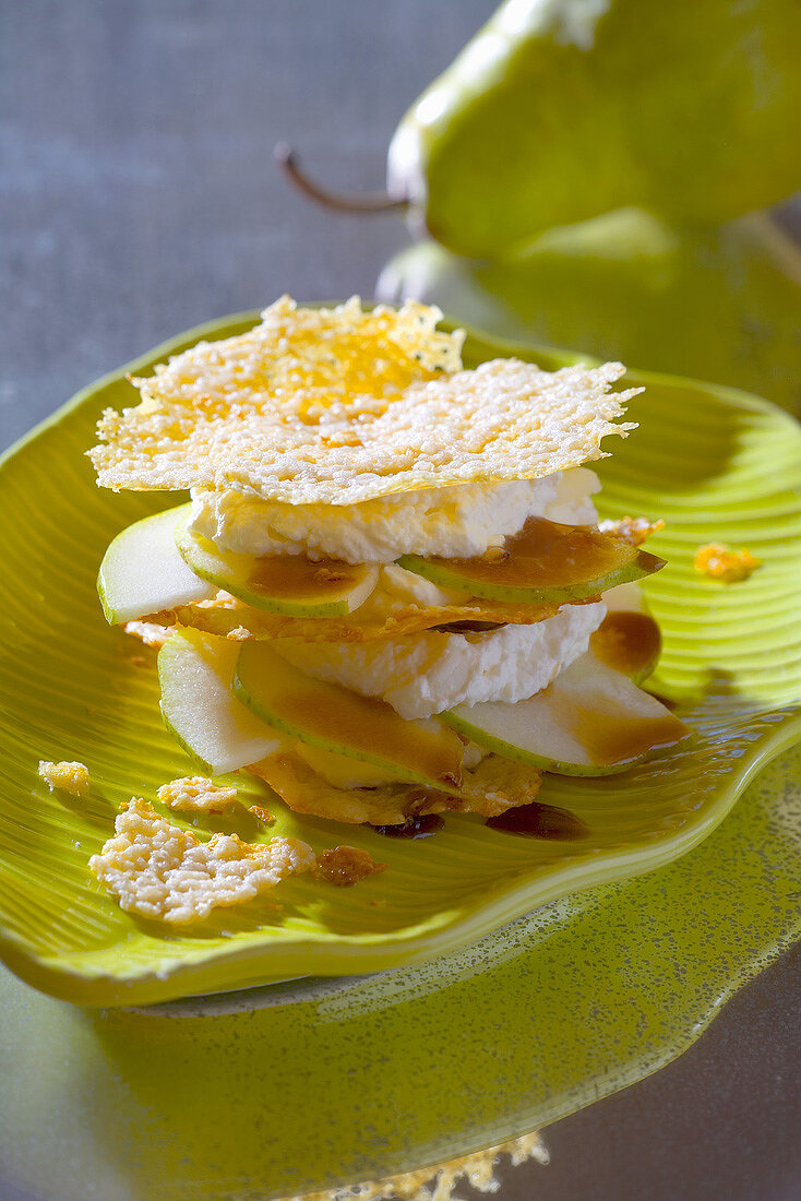 Tower of Parmesan crisps, soft cheese and pear slices