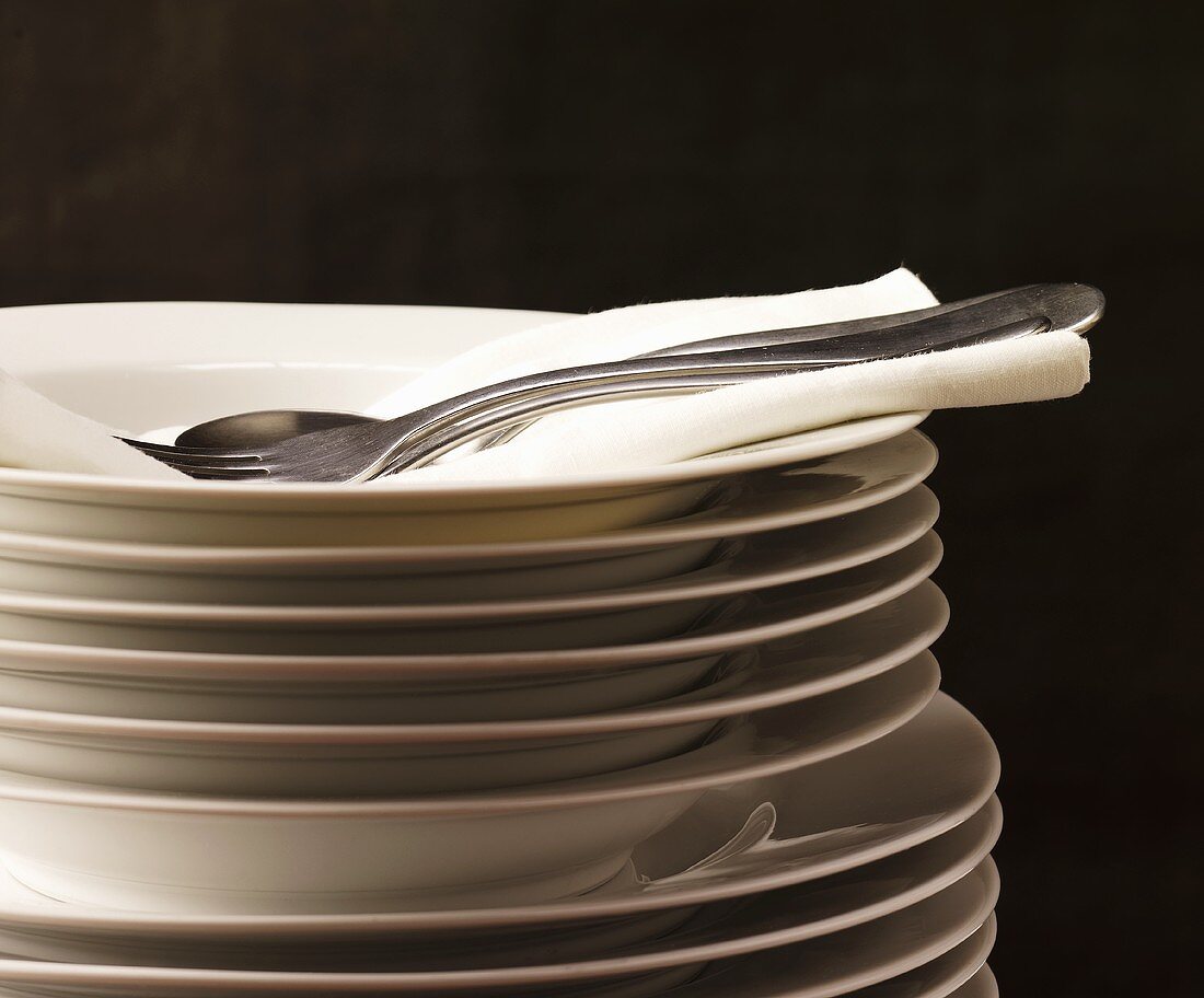 Stacked plates with napkin and cutlery