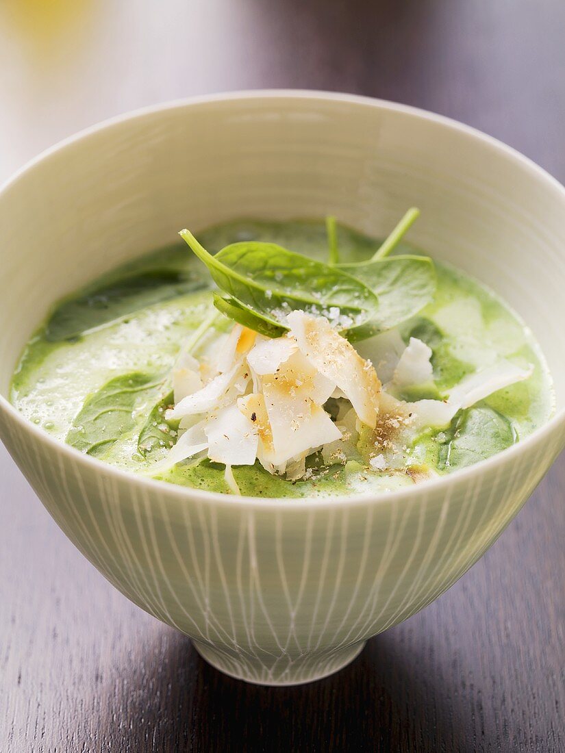 Spinach soup with garlic and coconut chips