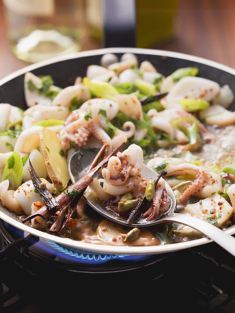 Fried squid with spring onions and cardamom