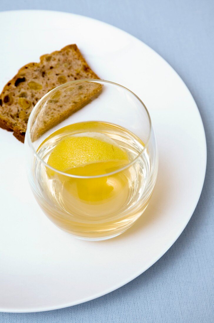 White wine with warm whisky and lemon