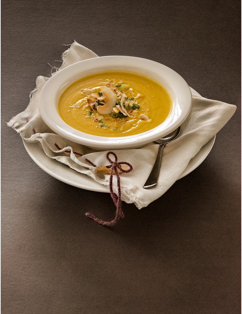 Sweet potato soup with sesame and toasted coconut shavings