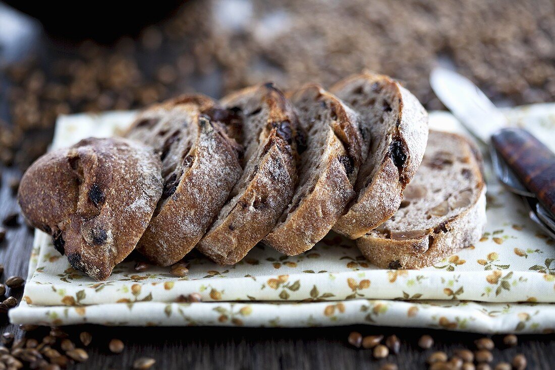 Sliced fig bread on a floral-patterned cloth