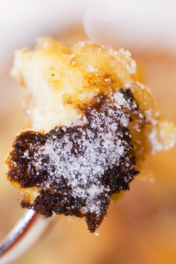 Kaiserschmarren (shredded sugared pancake from Austria) on a fork