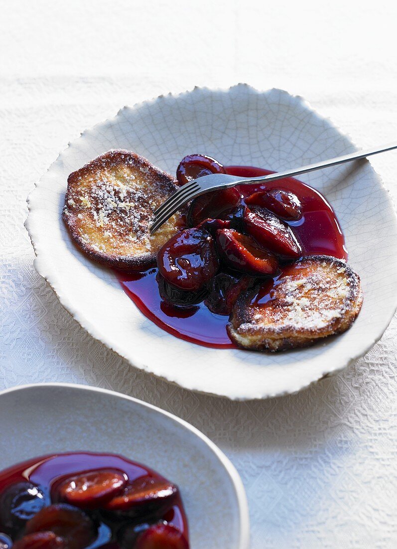 Lemon pancakes with plum sauce