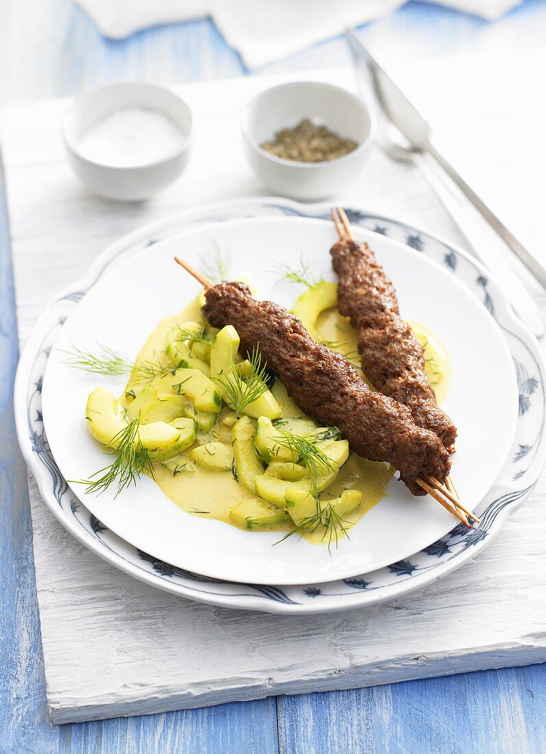 Minced meat kebabs with cooked cucumbers