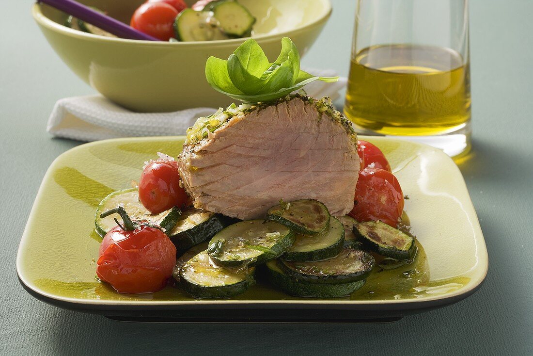 Tuna on a bed of tomatoes and courgettes