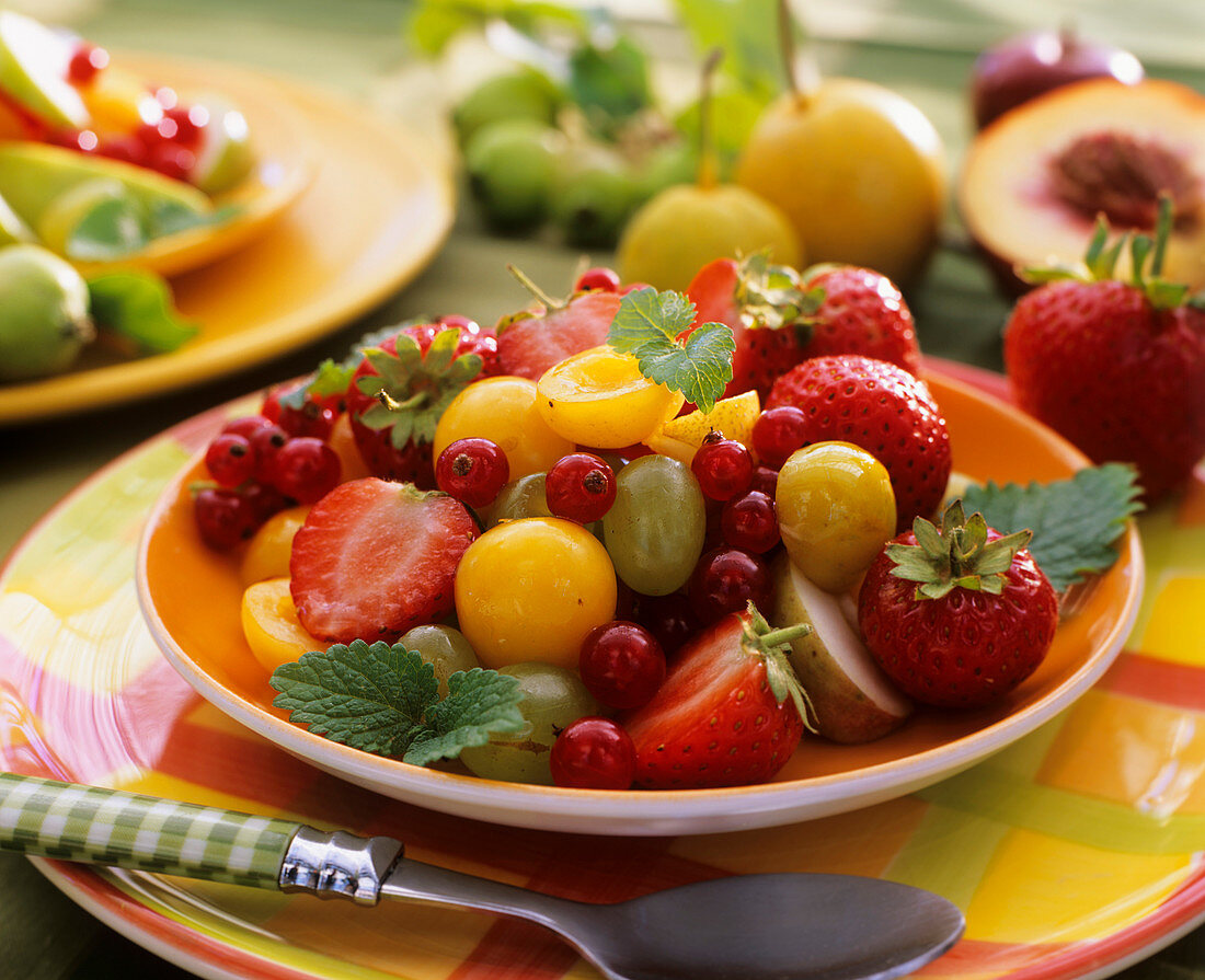 Fruit salad with summer fruit and lemon balm