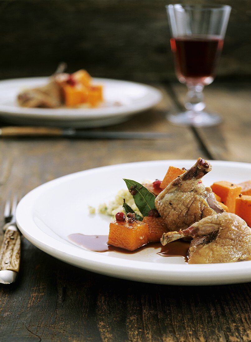 Quail legs with pumpkin and cranberry sauce