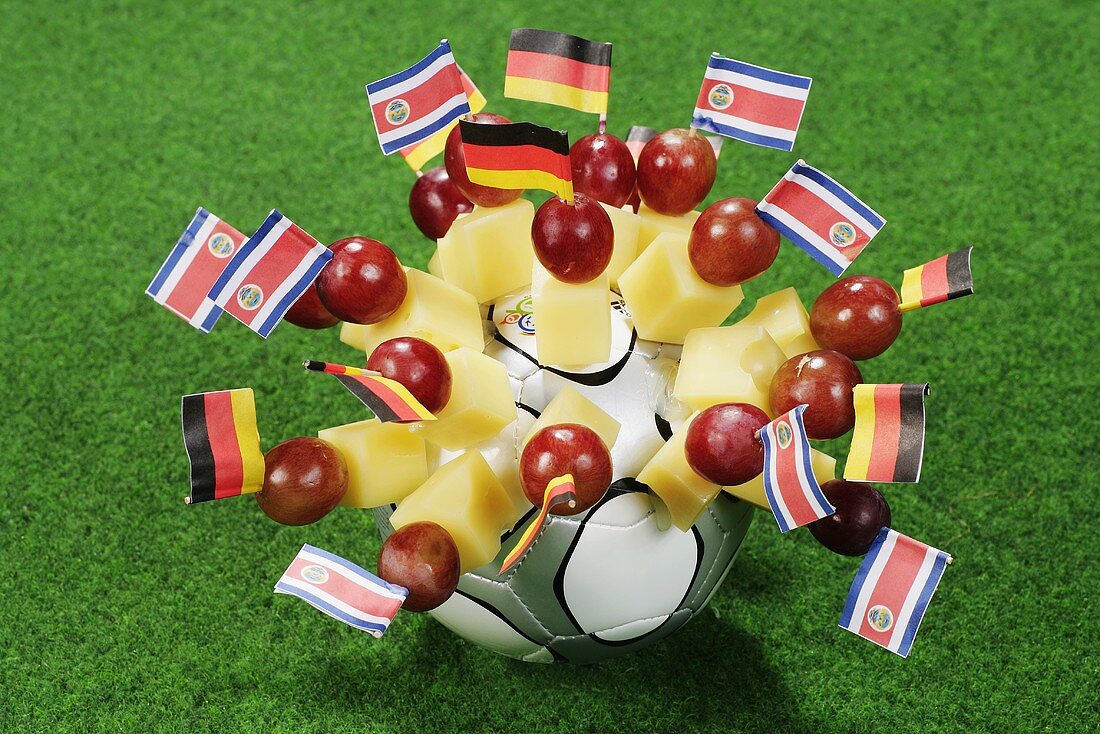 Cheese on cocktail sticks with flags of Germany and Costa Rica