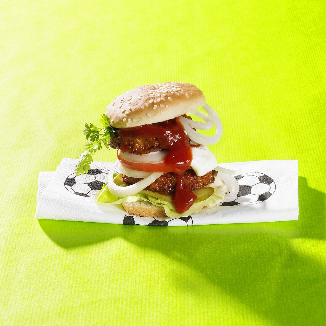Burger on napkin with football motif
