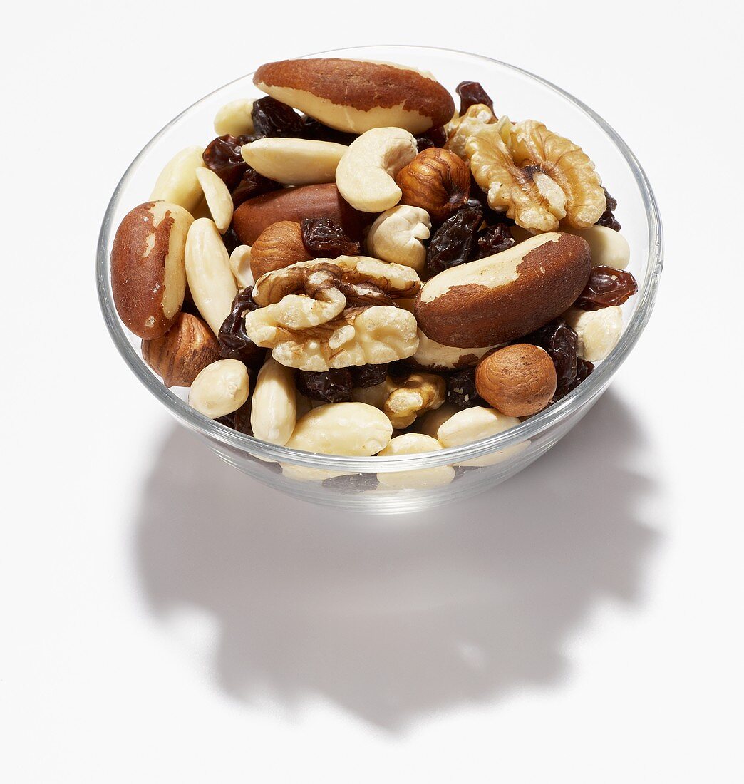 Glass bowl of nuts and raisins