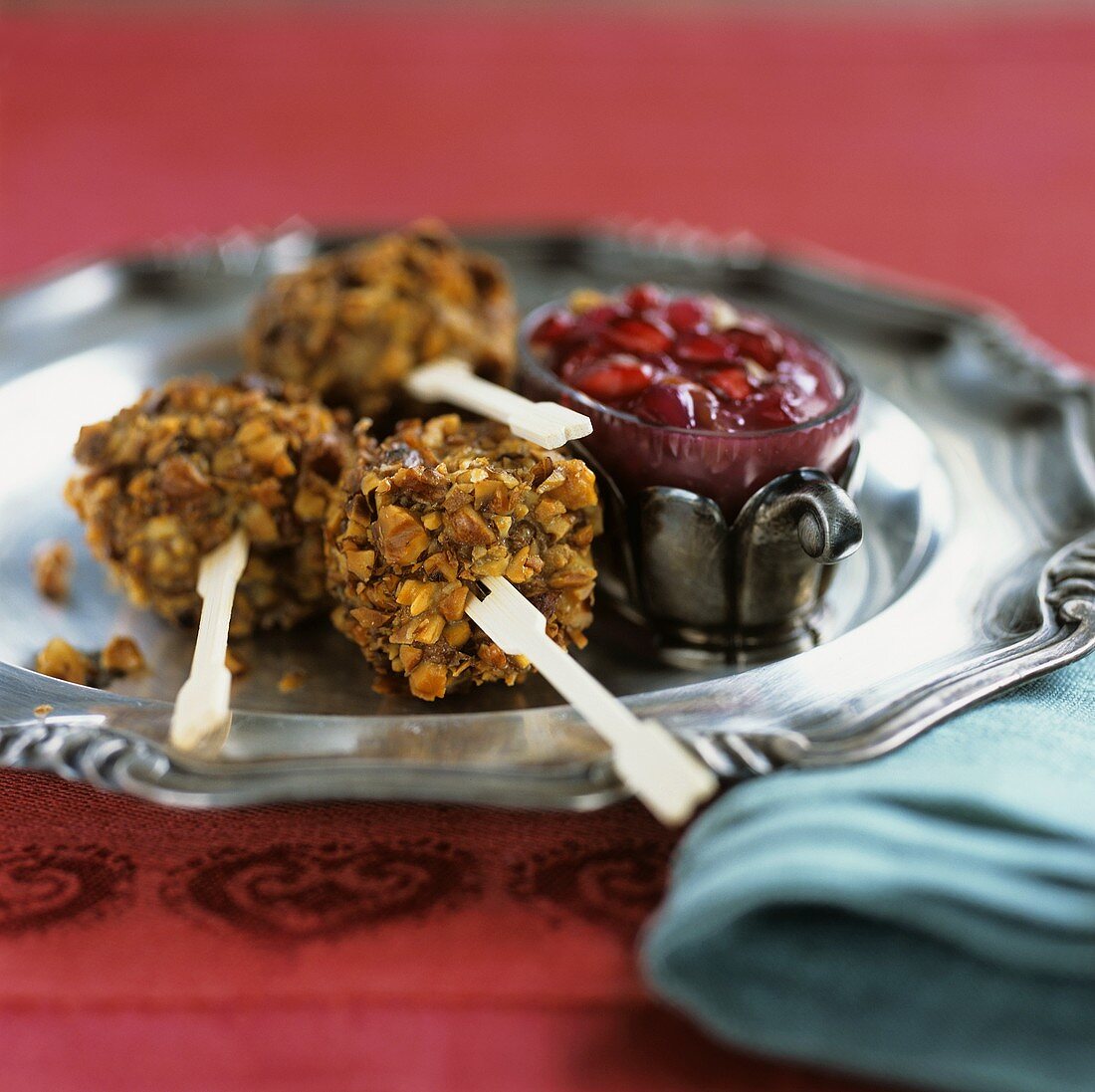 Chicken with nut crust and pomegranate dip