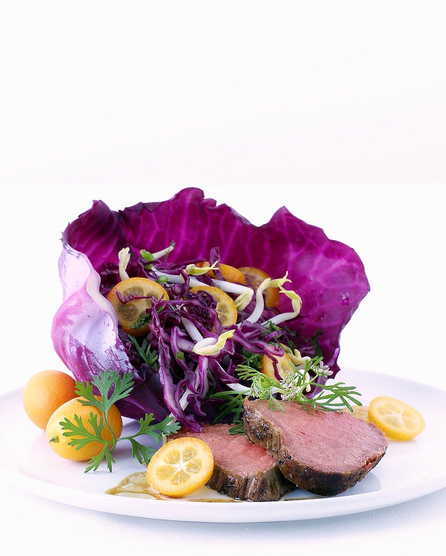 Sweet & sour red cabbage salad with kumquats & warm roast beef