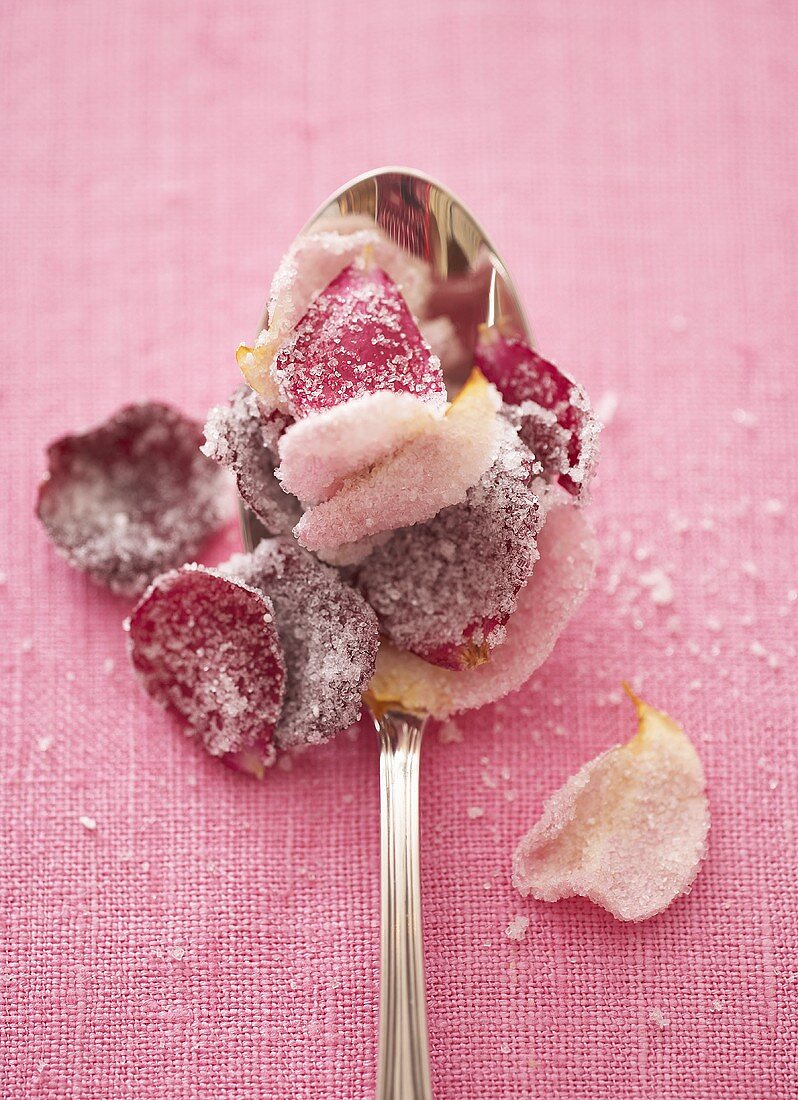 Candied rose petals on spoon