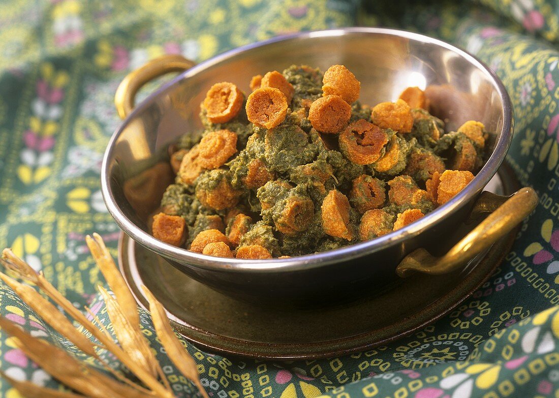 Dhania mangodi (Lentil dumplings with coriander sauce, India)