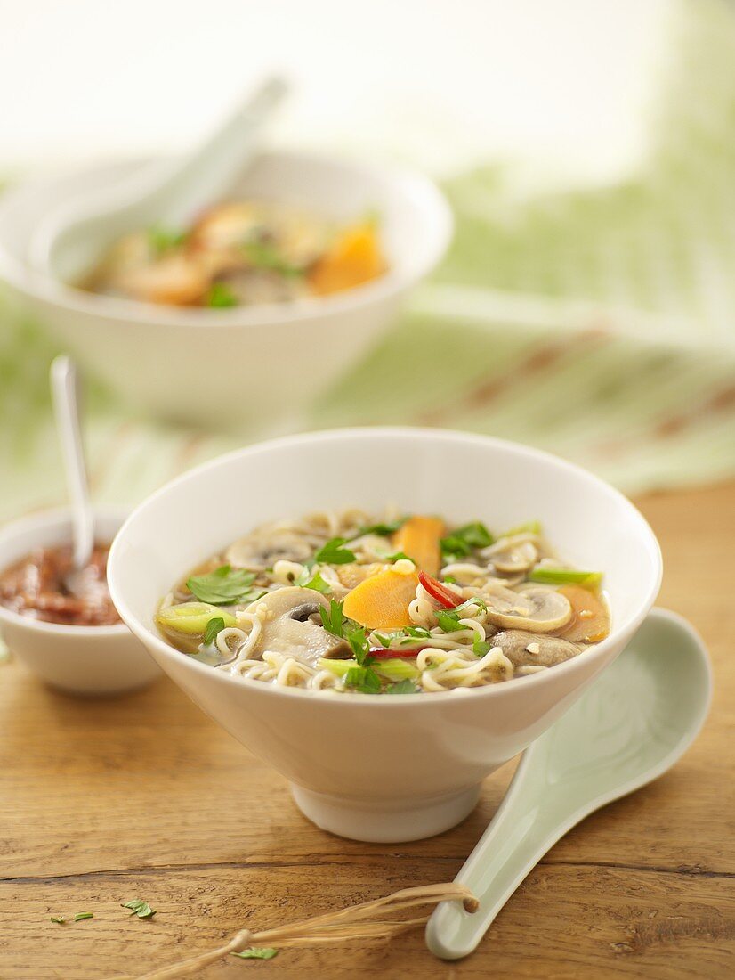 Asian-style vegetable soup with egg noodles