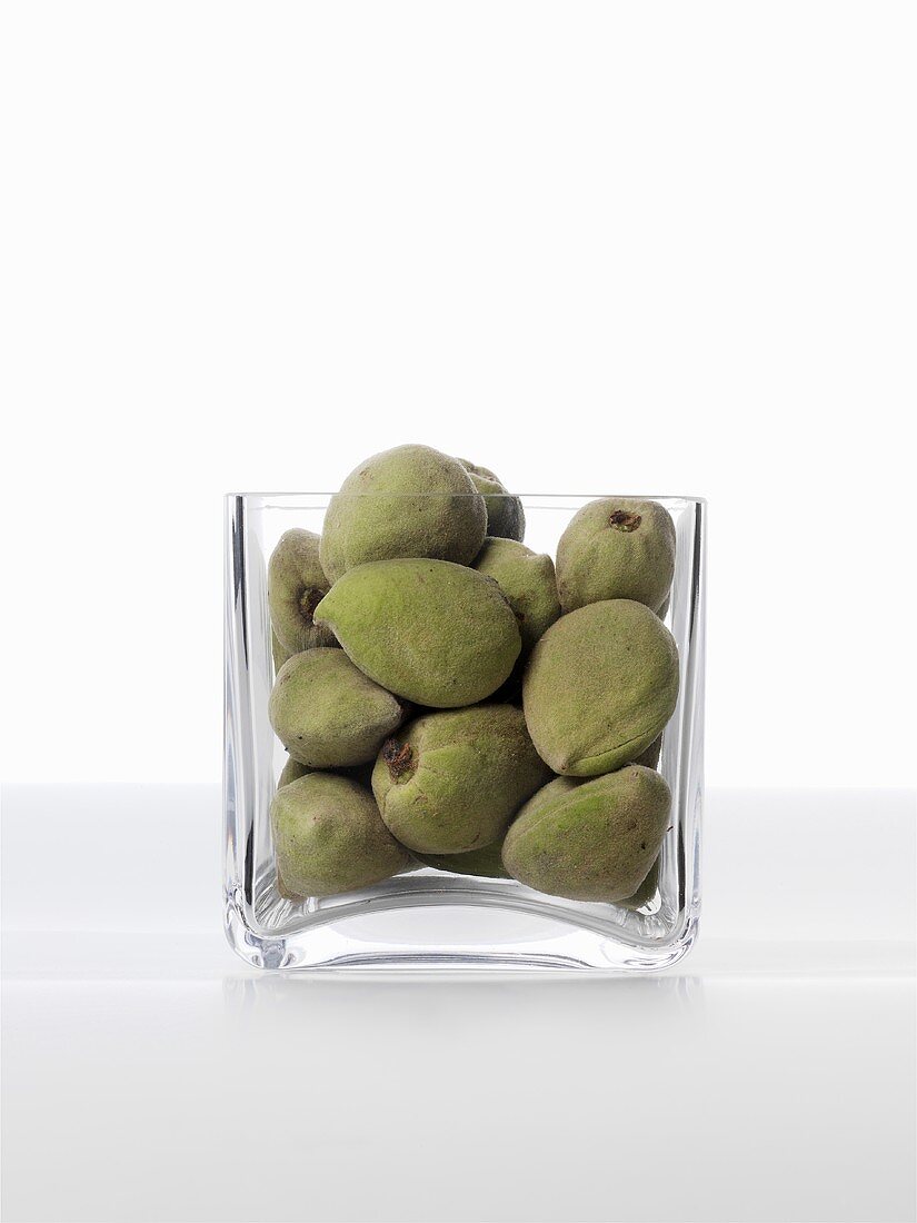 Unshelled almonds in glass bowl