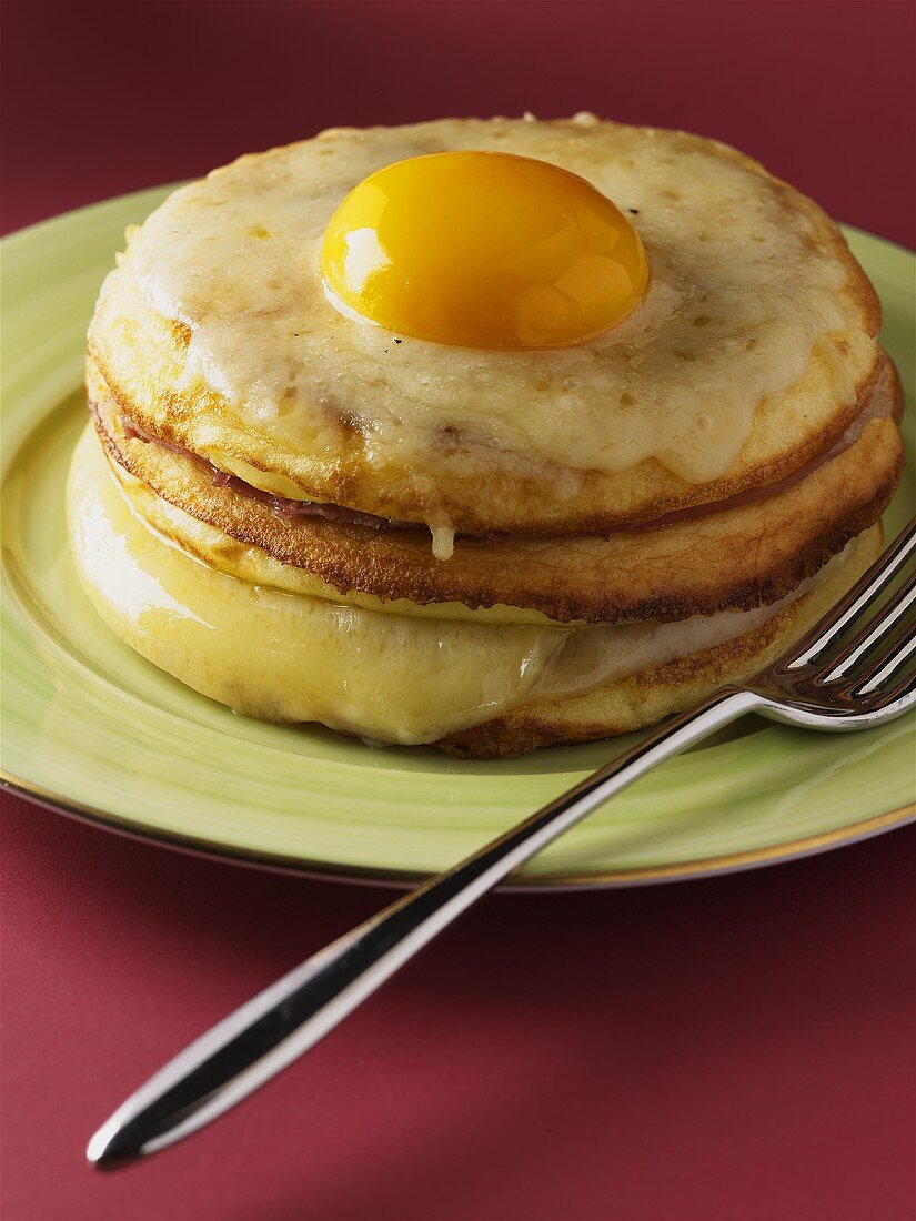 Pancakes with cheese and fried egg