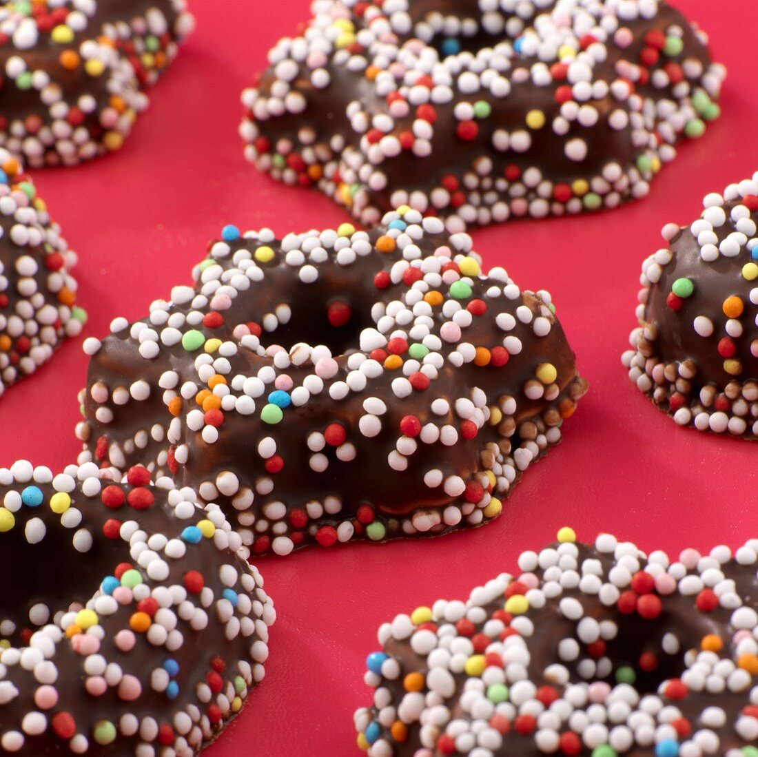 Chocolate stars with coloured sprinkles