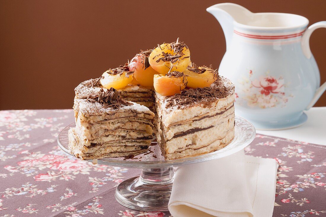 Oblatentorte (wafer cake) with coffee cream & apricots, a piece cut
